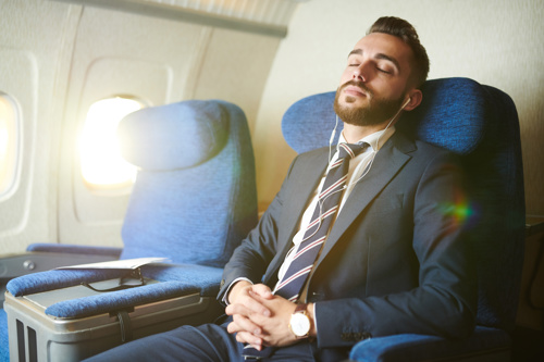 a passenger listening to calming music during a flight.